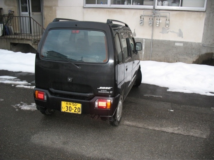 A rear view of my car, a Suzuki Wagon R, in Japan.