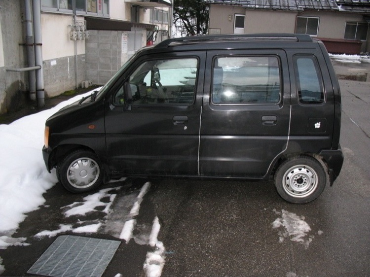 A side view of my car, a Suzuki Wagon R, in Japan.