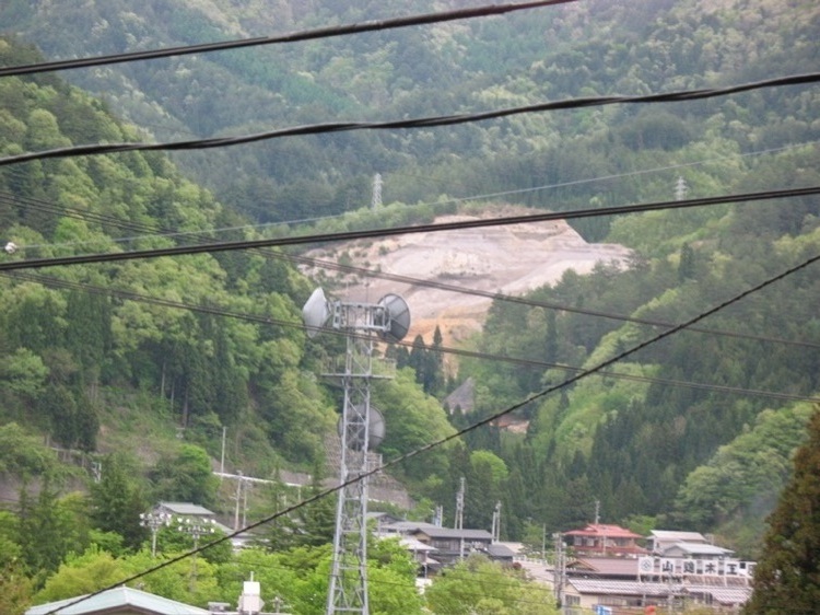 A mountain crisscrossed by wires.